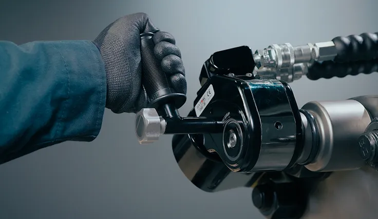 HYTORC EDGE S hydraulic torque wrench in use with the side safety handle