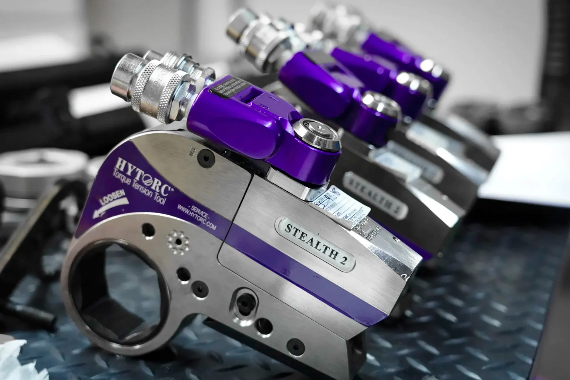 A row of HYTORC STEALTH hydraulic torque wrenches
